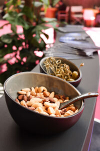 Small tray with smoked almonds and salted nuts