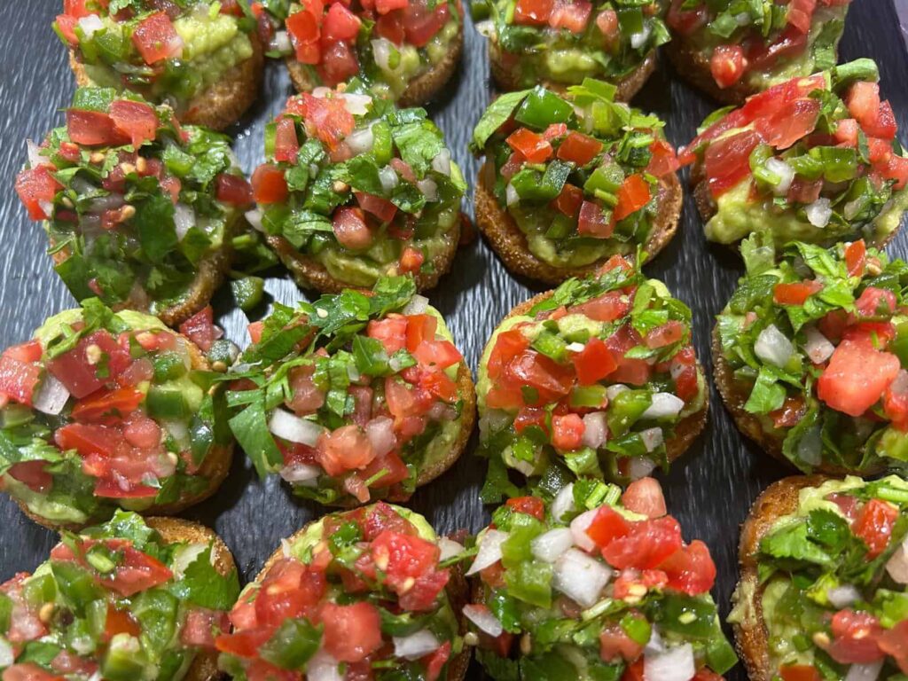 Vegan canape crostini with guacamole and Pico de Gallo